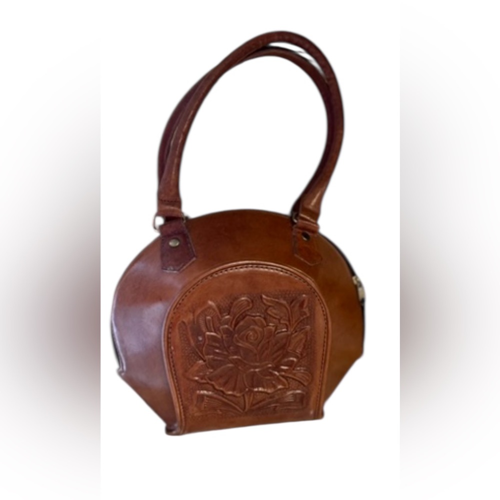 Vintage dark brown ellipse-shaped top-handle bag.